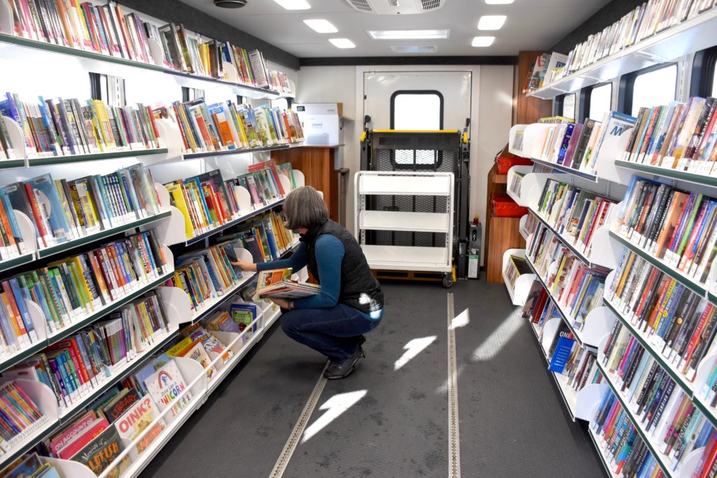 Shelving books on the bookmobile
