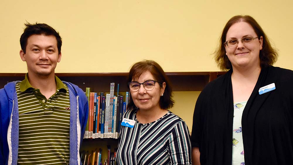 Librarians Schiree (Supervisor), Maureen, and Dottie